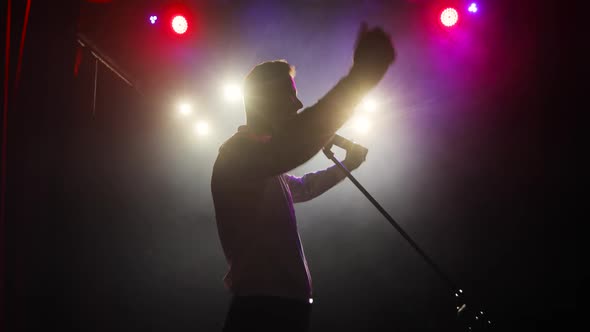 Man Artist Taking the Stage and Greeting Audience Before Performance. alt