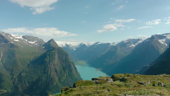 Blue Waterscape Of Oldevatnet Lake At The Valley Of Oldedalen In Olden Village, Norway. aerial alt