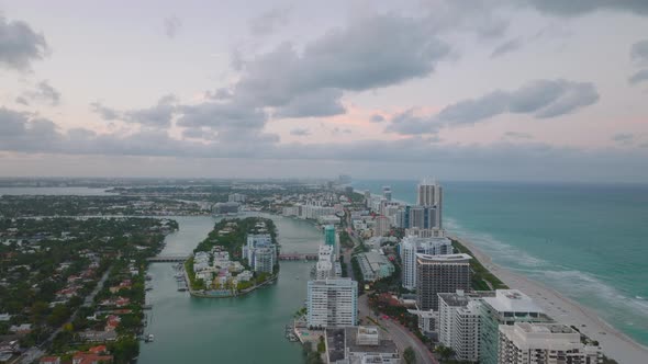 Forwards Fly Above City at Dusk alt