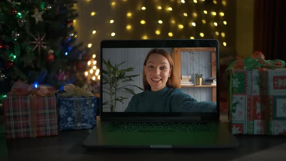 Smiling Woman on a Videocall She Is Happy and Wishing a Merry Christmas Online