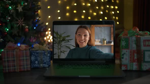 Smiling Woman on a Videocall She Is Happy and Wishing a Merry Christmas Online alt