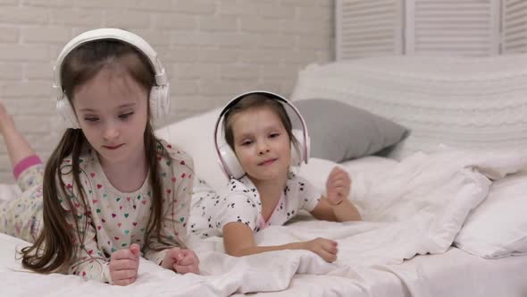 Little Child Baby Girl Listening To the Music with Headphones