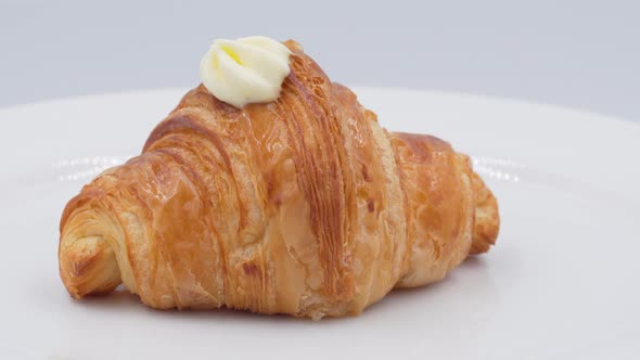 Croissant with cream rotating in front of camera, Rotates view of Hokkaido Milk Cream Croissant