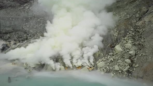 Sulfur Springs on the Lake in the Vent of a Sleeping Volcano Sulfur Smoke Comes Out From Under the alt