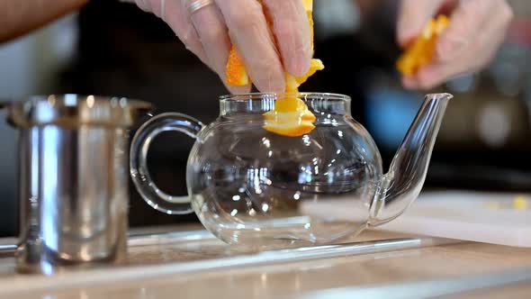 Crop Barista Preparing Orange Tea