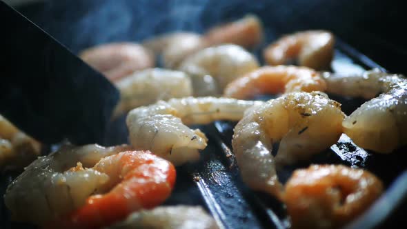 Mixed Large Red Shrimps Are Fried in Hot Boiled Oil on Pan, Close-up