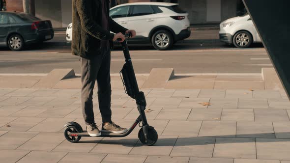 E-scooter Rider, Man Ride Sharing or Rent Personal Eco Transportation. Man Hipster Riding an alt