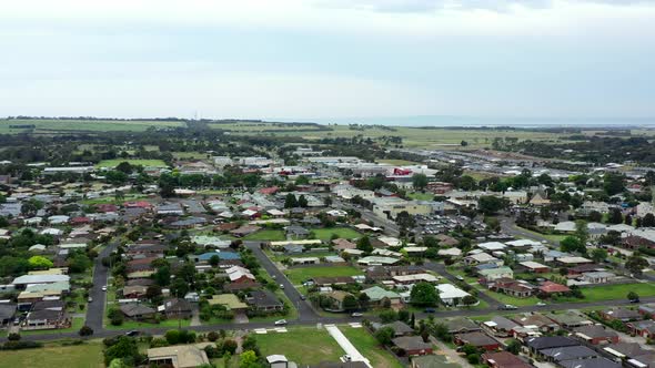 AERIAL Local Streets Of Country Coastal Township And Shopping Strip alt