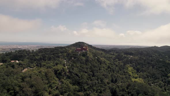 Scenic aerial view of Sintra Natural Park, Portugal. Pena Palace standing out on the hills. alt