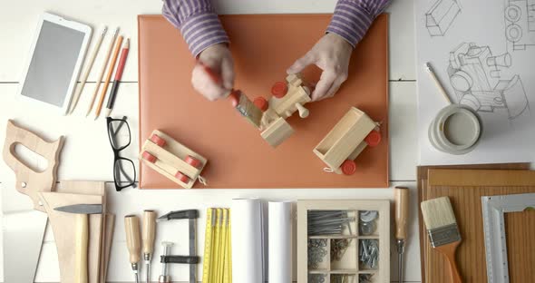 Creative craftsman and designer working at desk