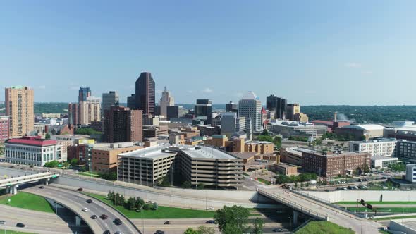 Aerial drone shot of Minneapolis, MN in the summer with traffic on highways alt