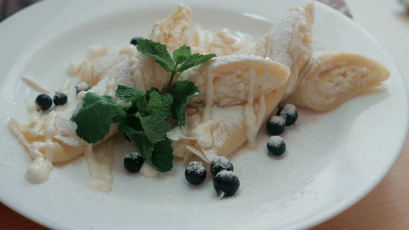 Cooking Rolled pancakes with cottage cheese. step by step alt