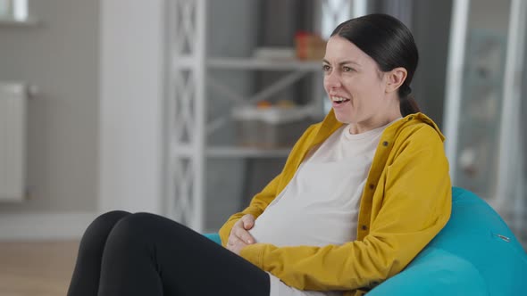 Pregnant Woman Laughing As Baby Kicking in Belly, Stock Footage | VideoHive