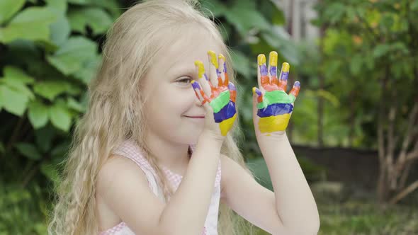 Child hands in paints