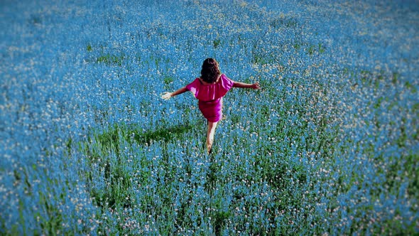 Young Fit Woman in Red Dress Walking By Blue Field Outdoors Fanstasy Enjoy Moment Freedom Creative