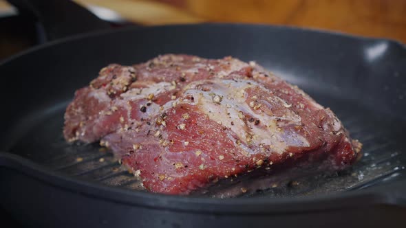 Delicious Juicy Meat Steak Cooking on Grill. alt