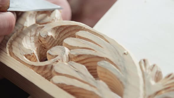 Closeup shoot of a woodcarver at work