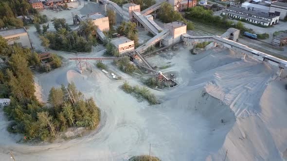 Mining Equipment at Rubble Barrows Surrounded By Forests alt