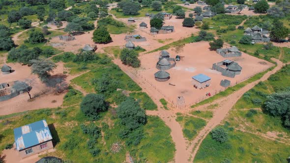 Flying over a small village with huts in Africa