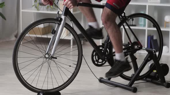 Sportsman Riding Bicycle Home Gym alt