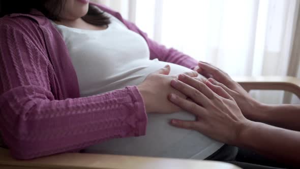 Pregnant Couple Feels Love and Relax at Home alt