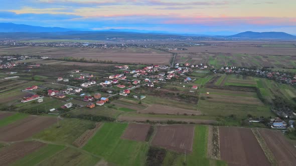 Aerial Top View of a Land with Down Green Fields in Countryside with Grown Plants alt