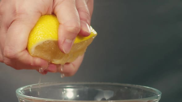 Squeezing Lemon Juice Into Bowl