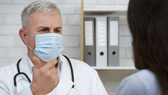 Doctor Talking Consulting Sick Female Patient Suggesting Treatment In Office alt