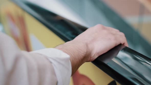 Close Up Male Hand on Escalator Handrail Riding Up Unrecognizable Man Boss Traveler Businessman alt