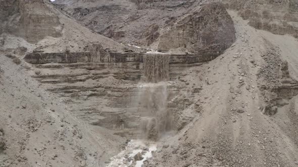 Desert dramatic cliff waterfall of flood water after the rain, Israel alt