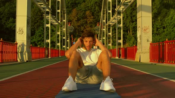 Front View of a Man Doing Abdominal Crunches alt