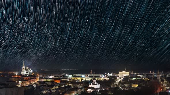 Night Tracks of Stars Timelapse Panoramic View to Old European City