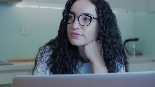 Woman Typing on Laptop Sitting on Sofa at Home, Businesswoman Sits at Home Types on Smartphone alt