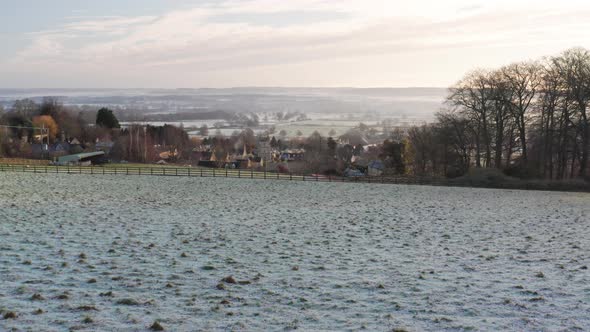 Aerial drone video of Typical English Cotswolds village and beautiful British countryside scenery, a alt
