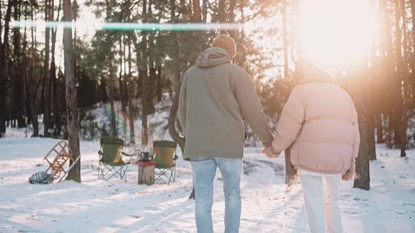 Romantic Couple Walk Through Their Wood Camp Holding Hands Enjoying Van Life