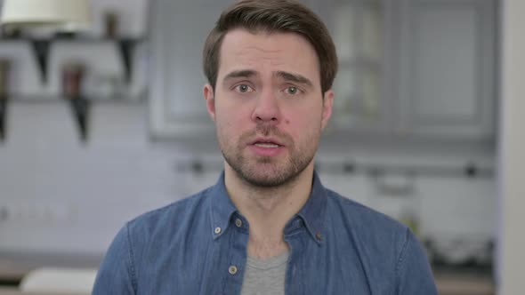 Portrait of Upset Beard Young Man Having Argument alt