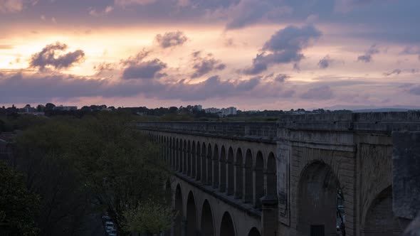 Timelapse of Saint-Clement Aqueduct at sunset alt