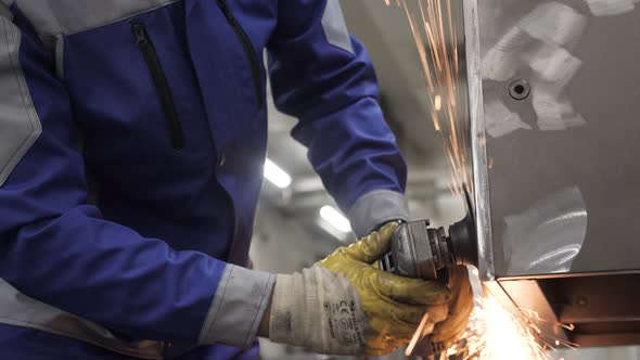 Steel work men grinding metal sparks grinder factory worker hand close up. Metalwork. Ironwork