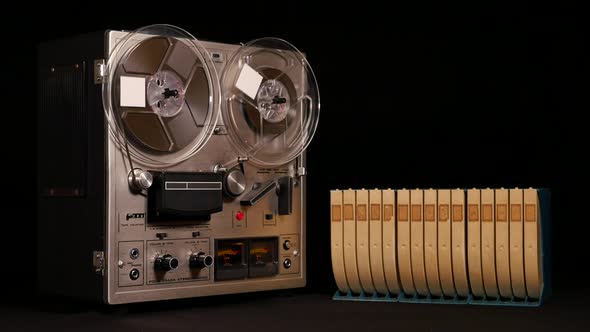 Taperecorder playing music isolated on black background and space for copy alt