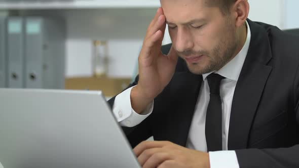 Company Boss Working on Laptop, Massaging Painful Temples, Migraine Problem