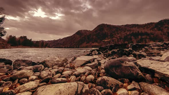 Time Lapse Shot of a River Near Mountain Forest. Huge Rocks and Fast Clouds Movenings. Horizontal alt
