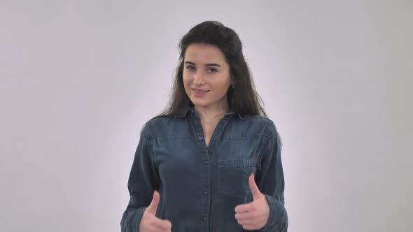 Female Smiling Shows Sign Like and Dislike alt
