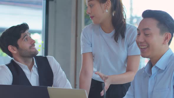 Three asian and caucasian Business people Working discuss finding new strategy solution alt