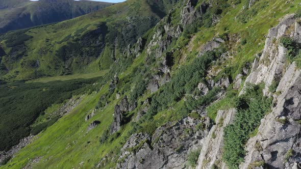 Aerial view of rocky peak of Spitz mountain in the Carpathian mountains, landscape alt