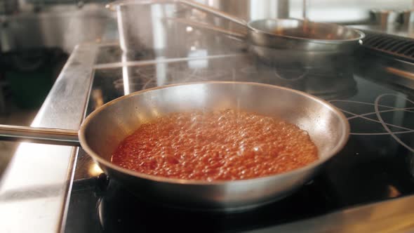 Chef Cooking Tasty Pasta Tomato Sause on Restaurant Kitchen Traditional Italian Food High Kitchen alt