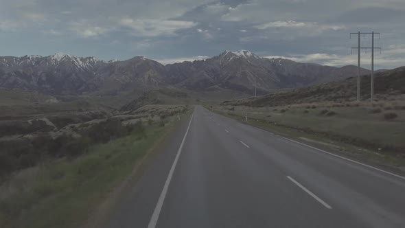 Flying above scenic road in the mountains