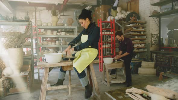 Woman and Man Have Fun On Pottery Class