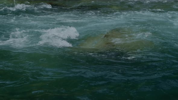 Pure mountain splash water flows over rocks, Wild River Clear Stream in Montenegro. alt