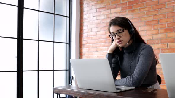 young beautiful women call center wear headset and working with computer alt