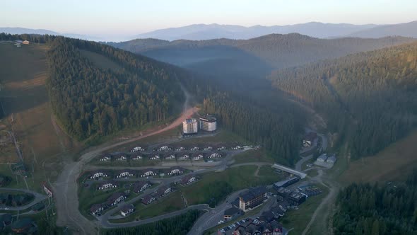 Aerial View of Sunrise Above Bukovel Ski Resort at Summertime alt